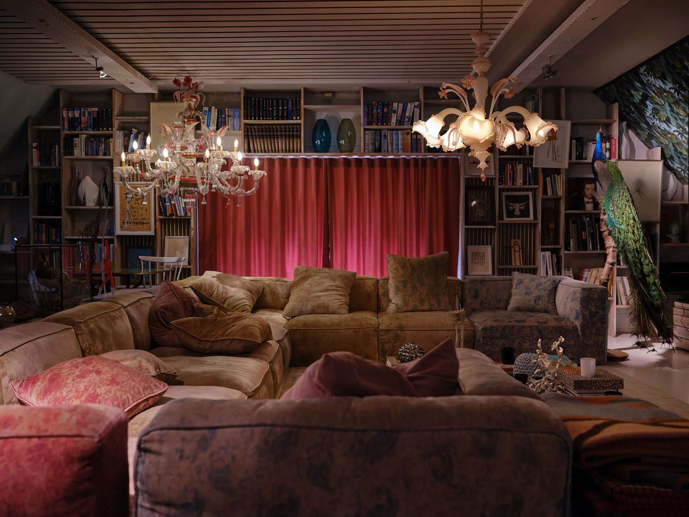 Cozy living room with luxurious chandeliers and elegant lighting, creating a warm and inviting atmosphere.