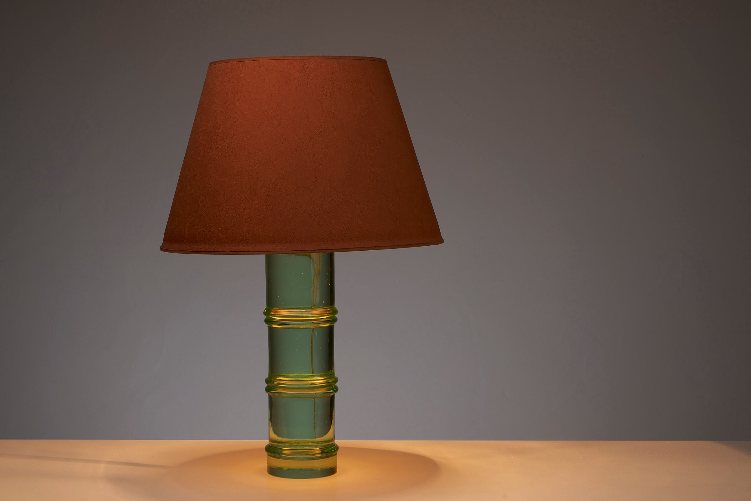 Solid glass table lamp with orange lampshade in the manner of Fontana Arte or Venini