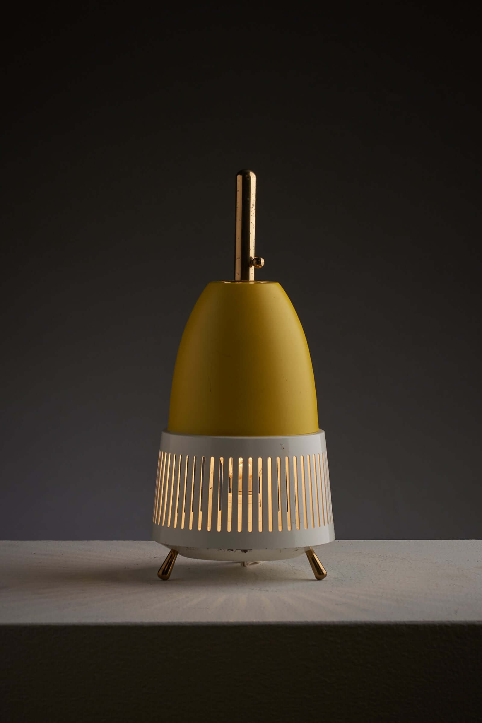 "Vintage-style brass lamp with metal shade"