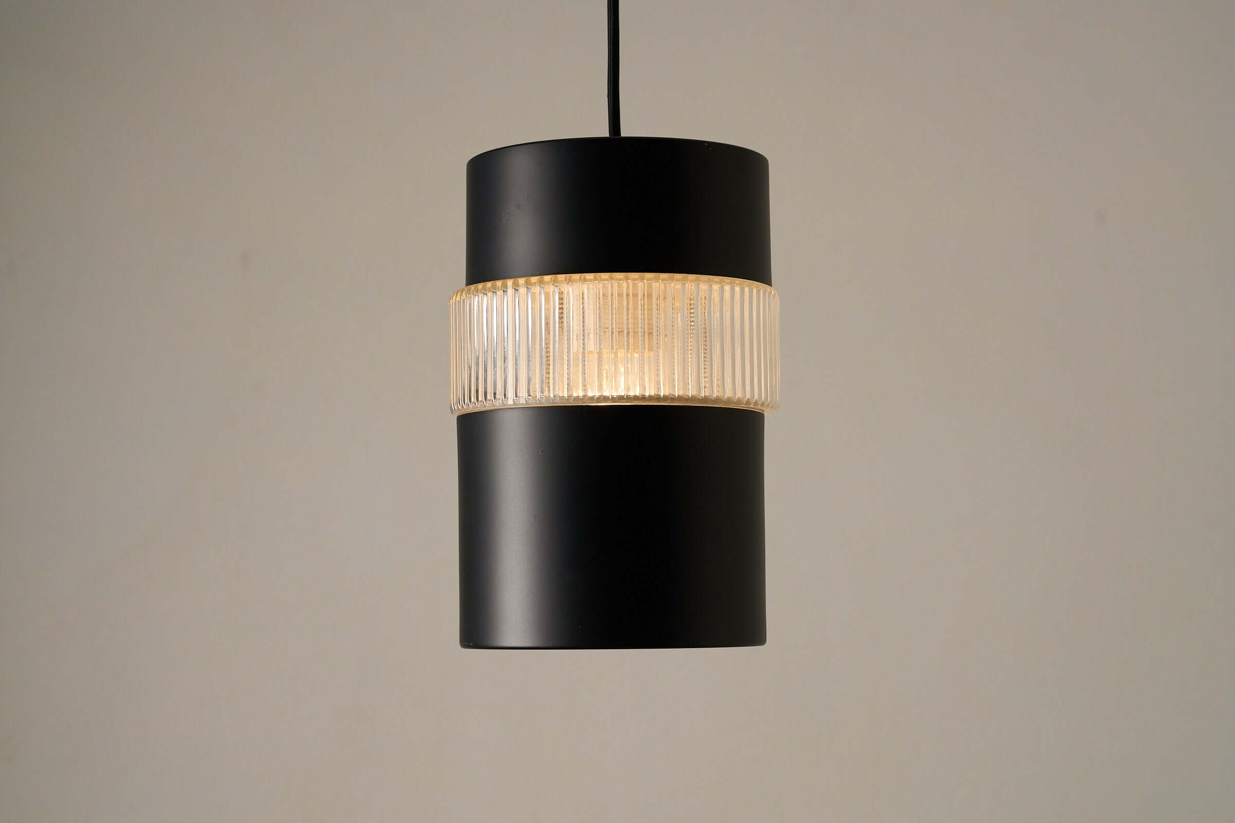 Vintage 1960s Cosack Leuchten black pendant lamp with textured glass and spring connection displayed against a neutral background