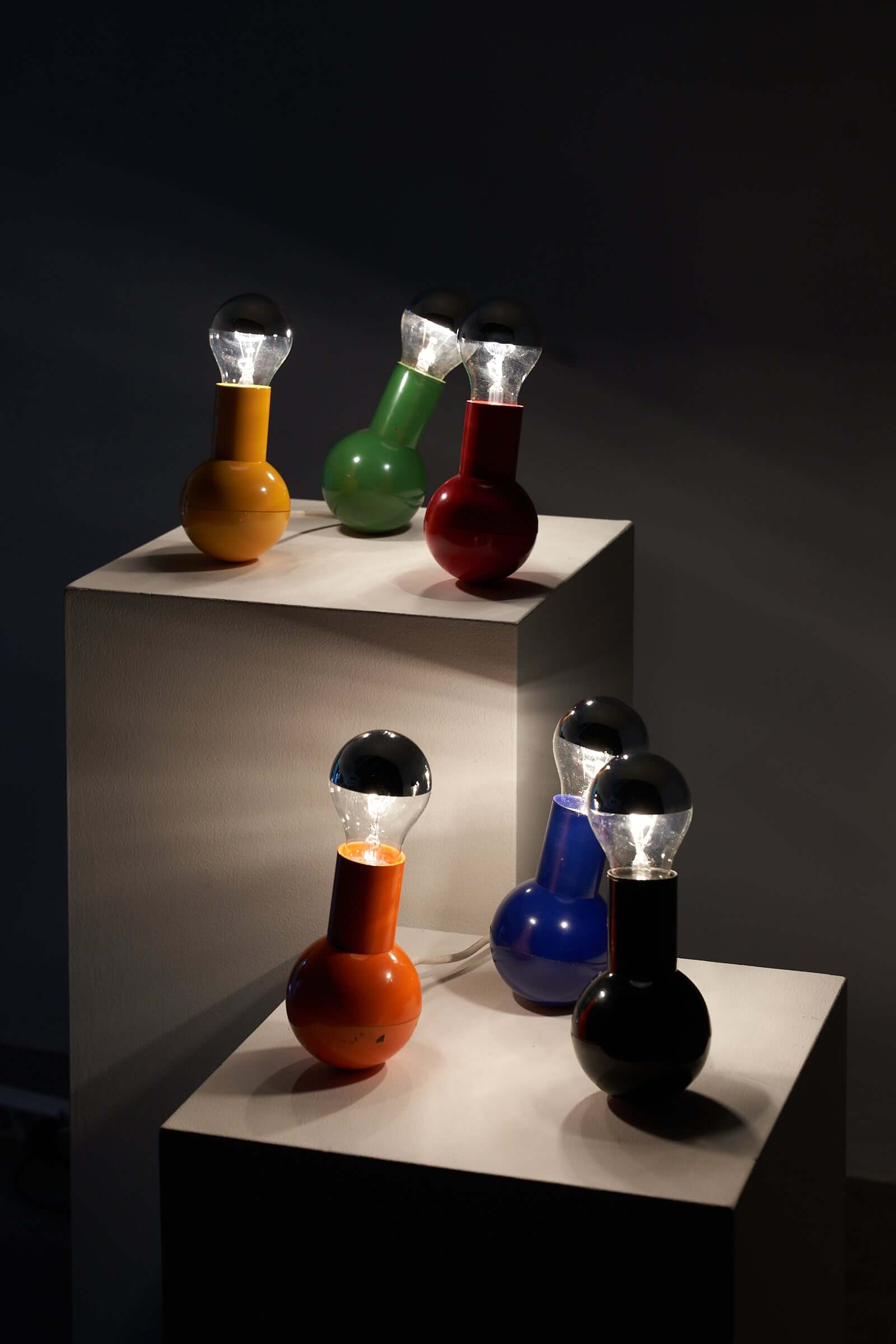 Vibrantly colored Kugel table lamps by Cosack Leuchten on display, showcasing unique bulbous designs and playful sophistication.