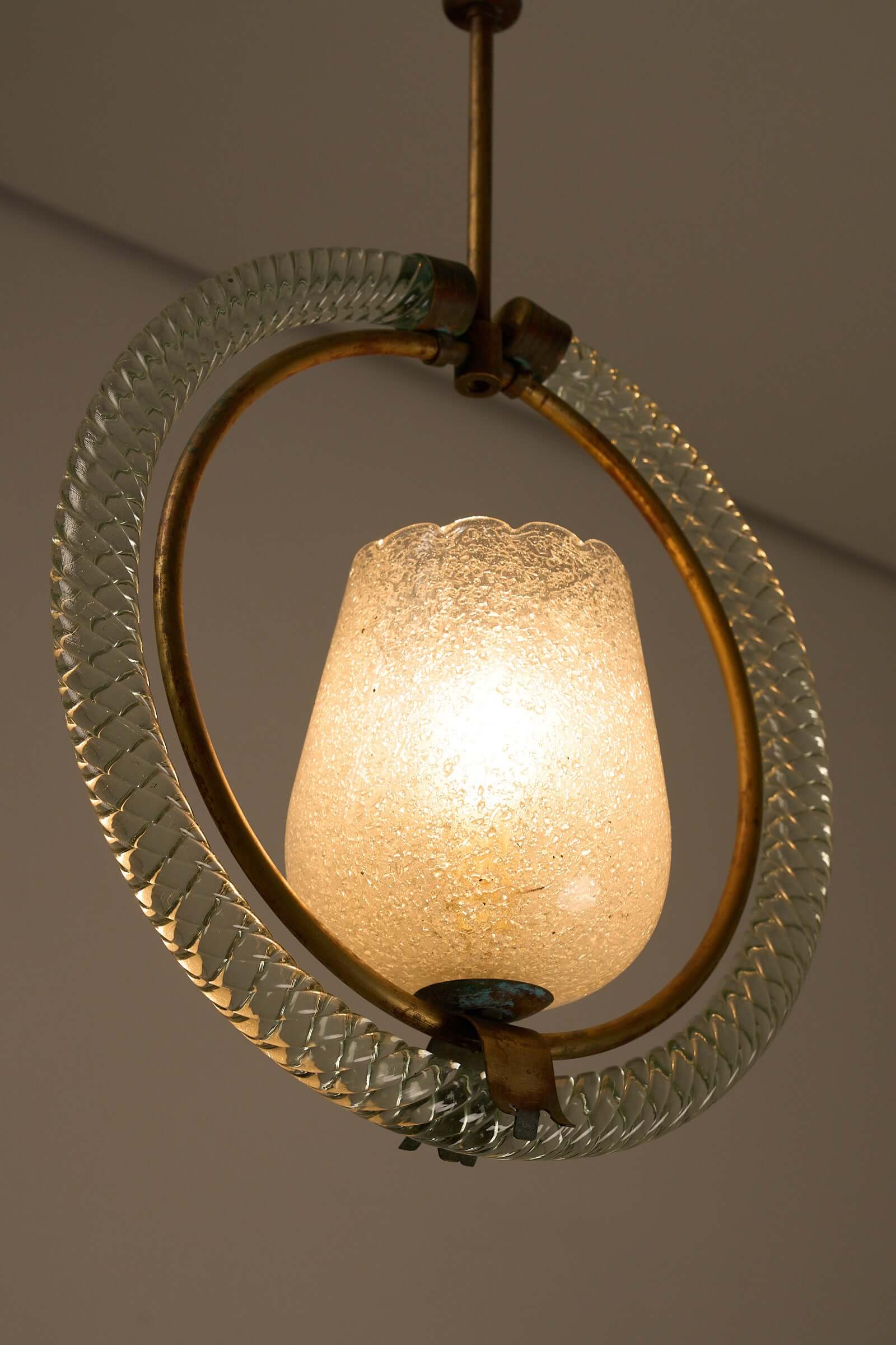 1930s Barovier & Toso Murano glass and brass chandelier with textured glass shade emitting warm glow