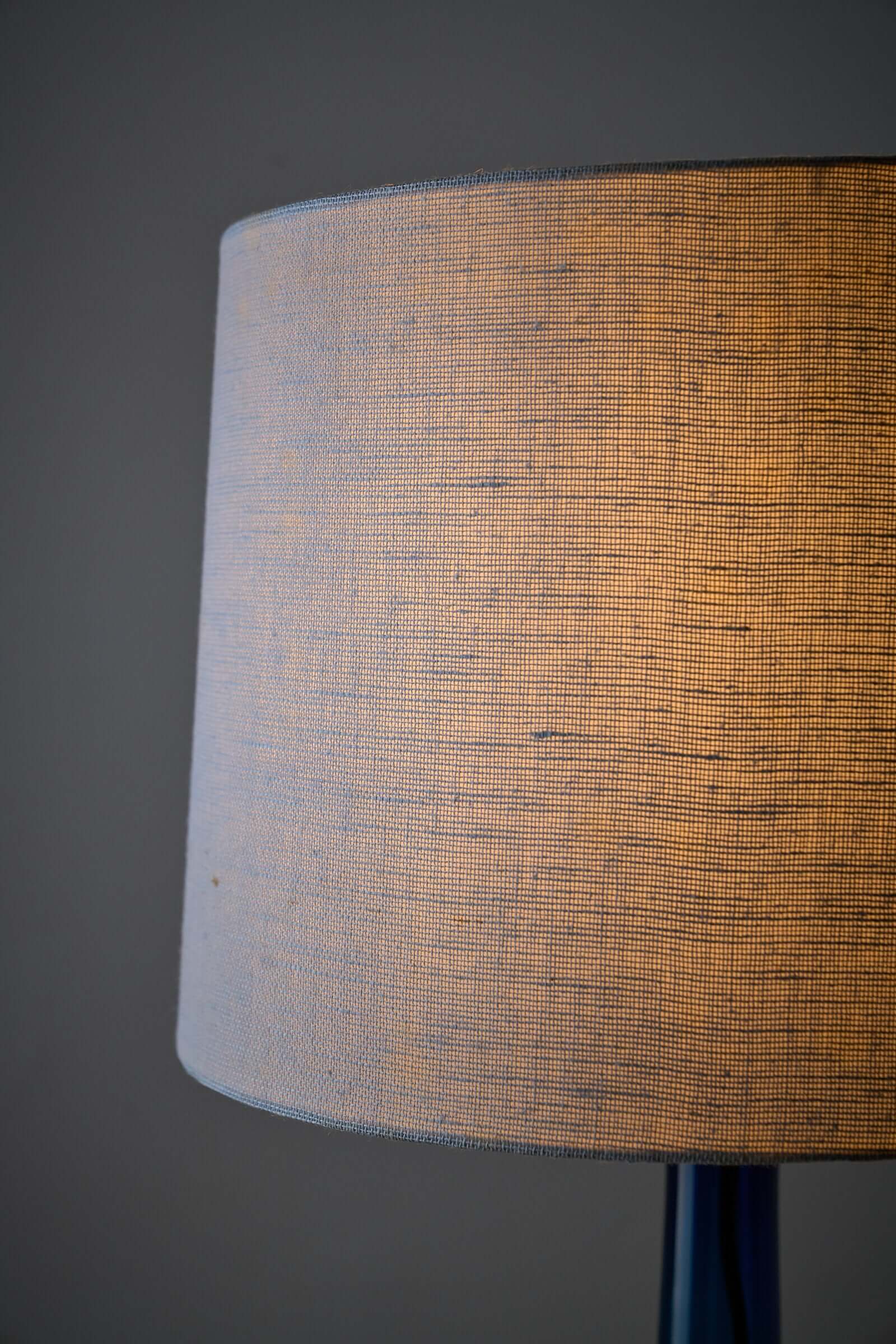 Close-up of the fabric shade of a Fog & Mørup table lamp, showcasing its textured design and warm glow.