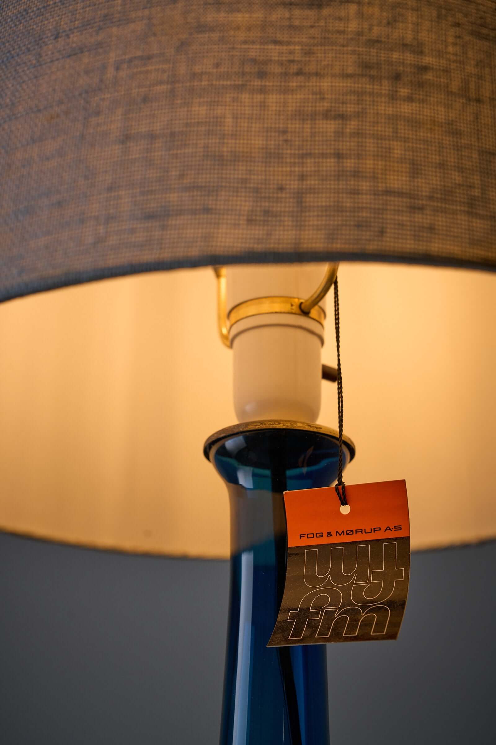 Fog & Mørup Lisbeth Brams blue table lamp featuring a unique glass base and original fabric shade.