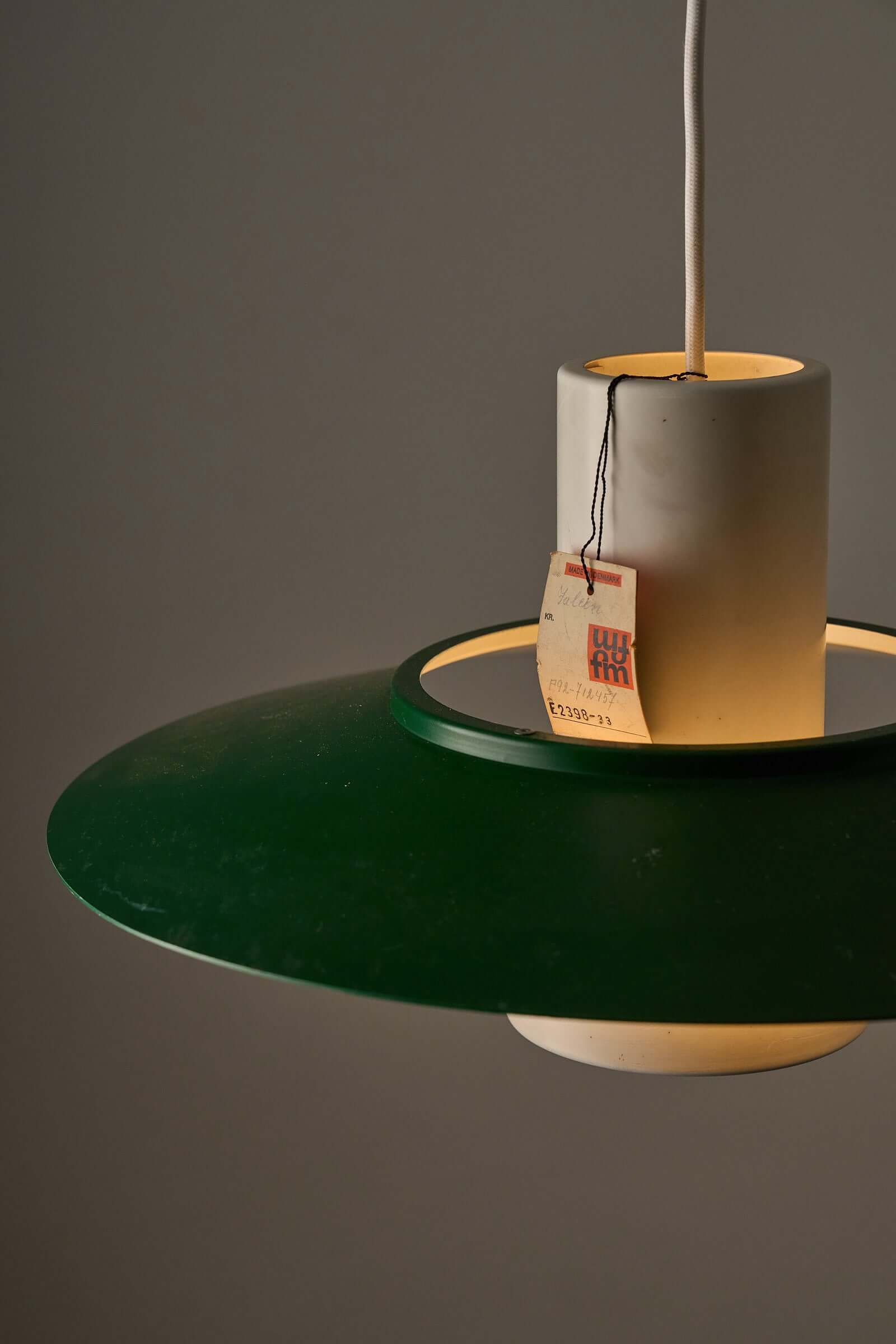 Vintage Falcon pendant light by Andreas Hansen with green shade and white core, showcasing Scandinavian design elegance.