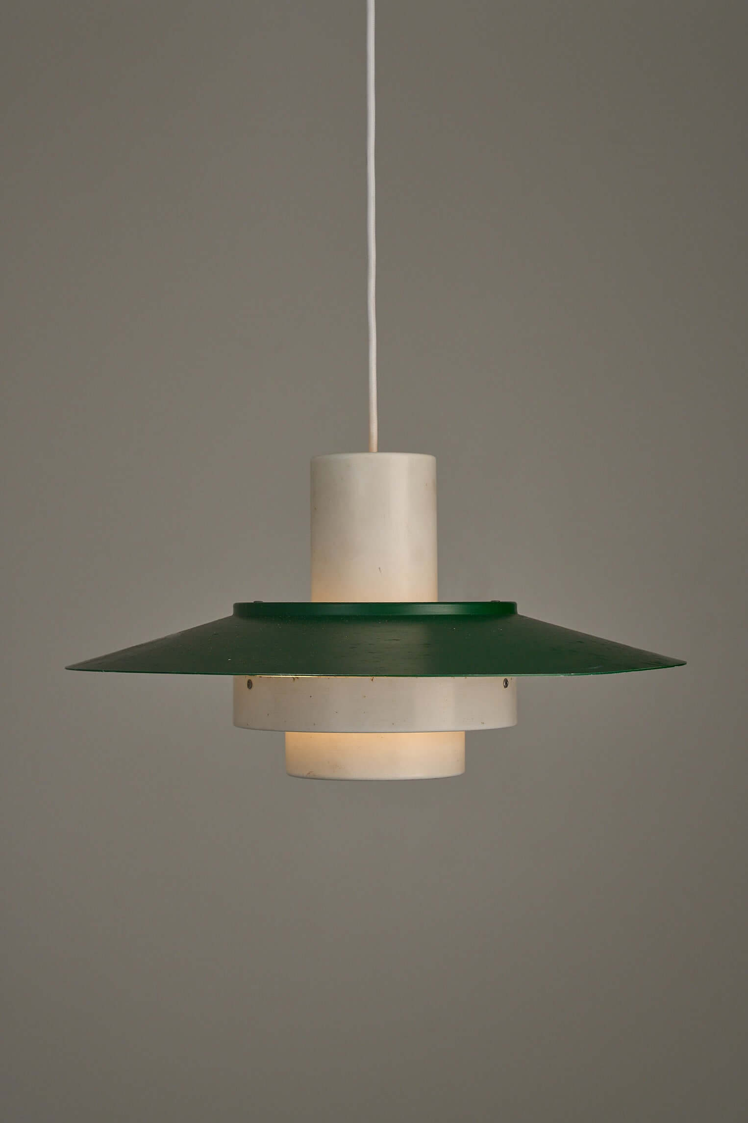 Vintage Falcon Pendant Light by Andreas Hansen, green lacquer shade with white core, iconic Scandinavian design.