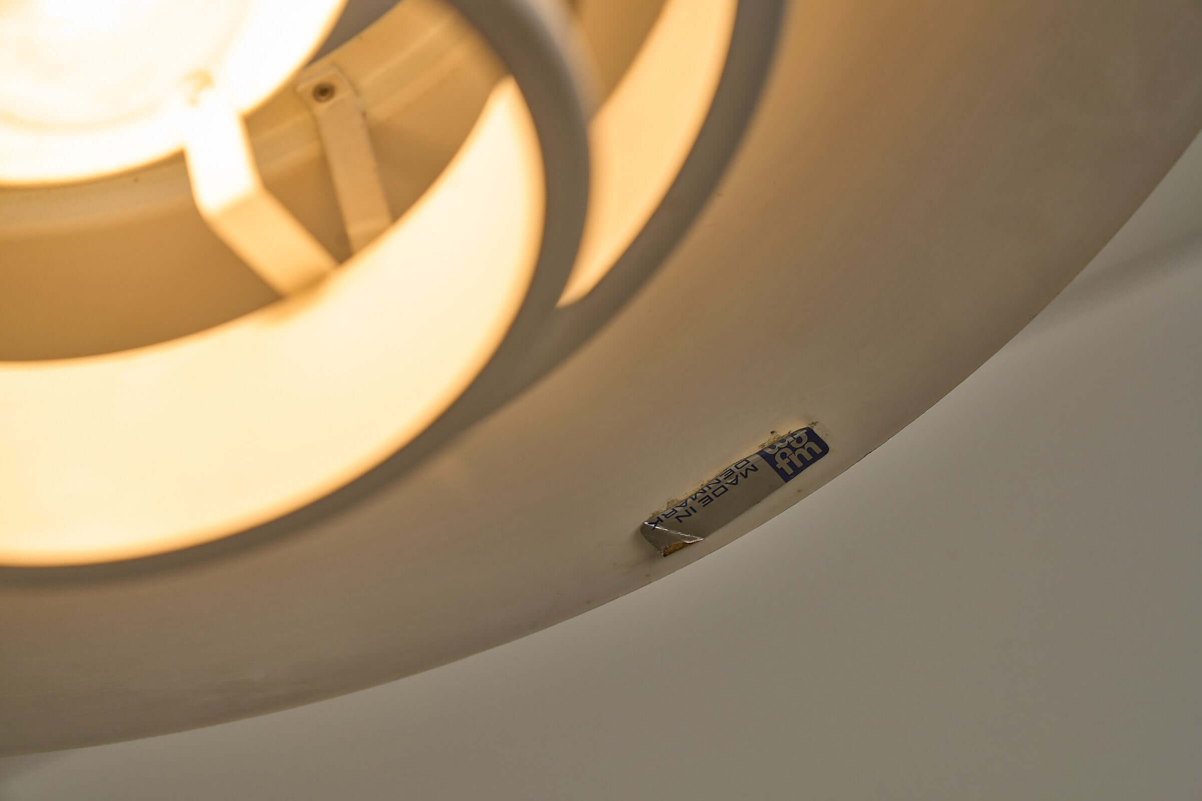 Close-up of Vintage Falcon pendant light showing underside and label by Fog & Mørup, designed by Andreas Hansen.