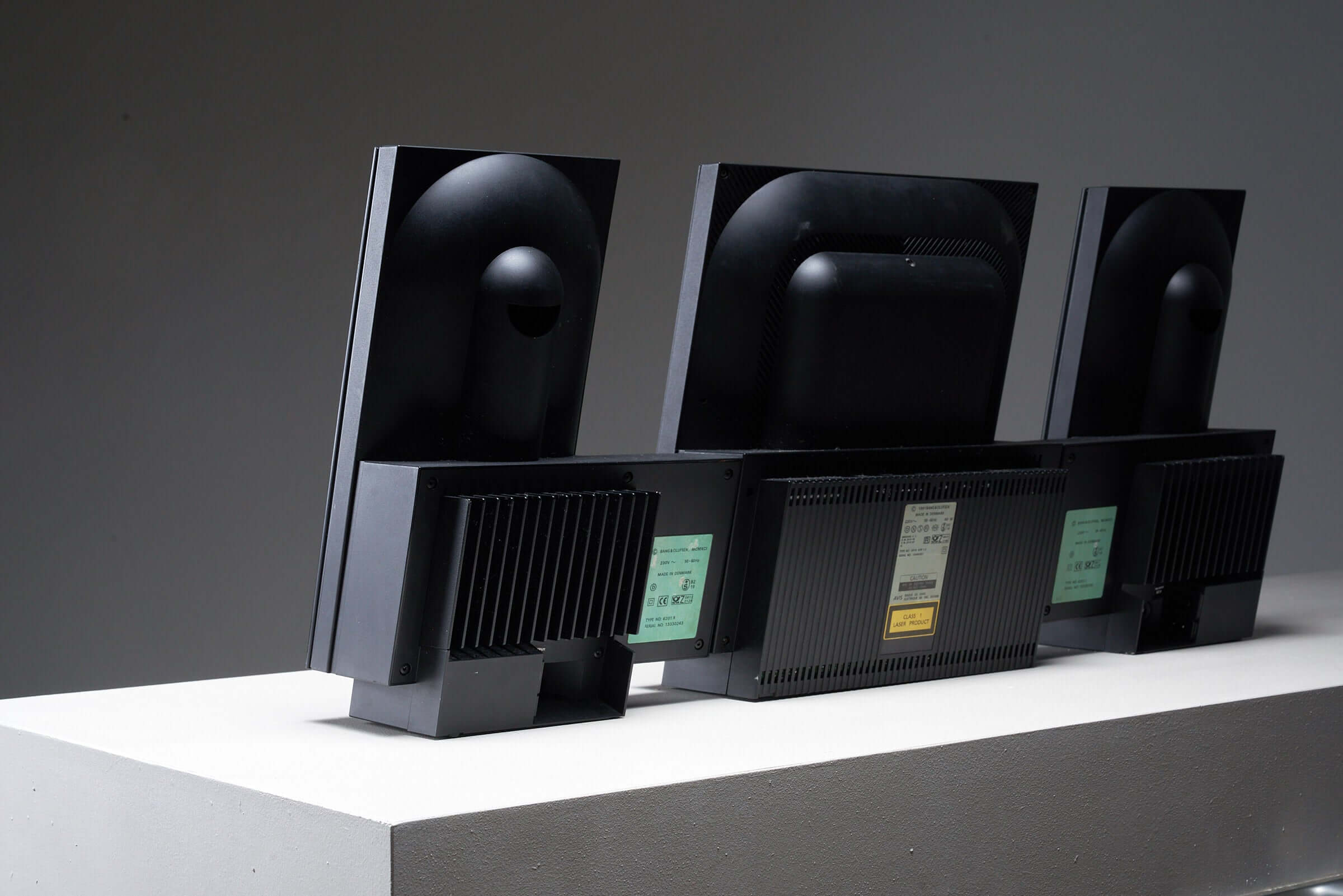 Rear view of Bang & Olufsen BeoSystem 2300 showing its minimalist black design and sleek glass front panels from the 1990s.