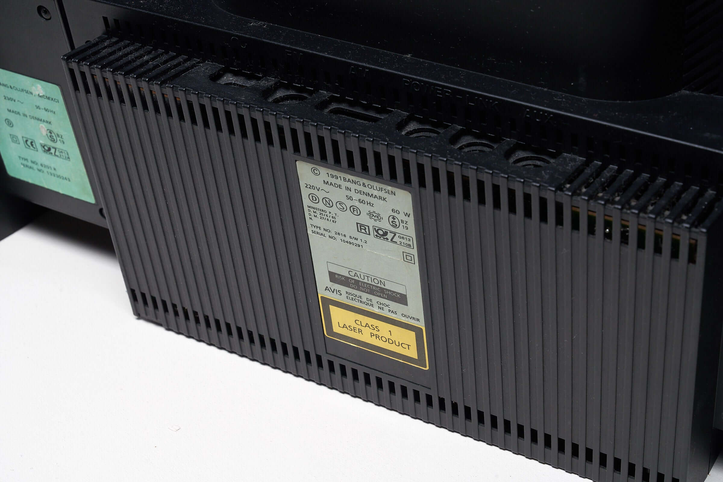 Close-up of the back panel of the Bang & Olufsen BeoSystem 2300 audio system from the 1990s showing the labels and connection ports.