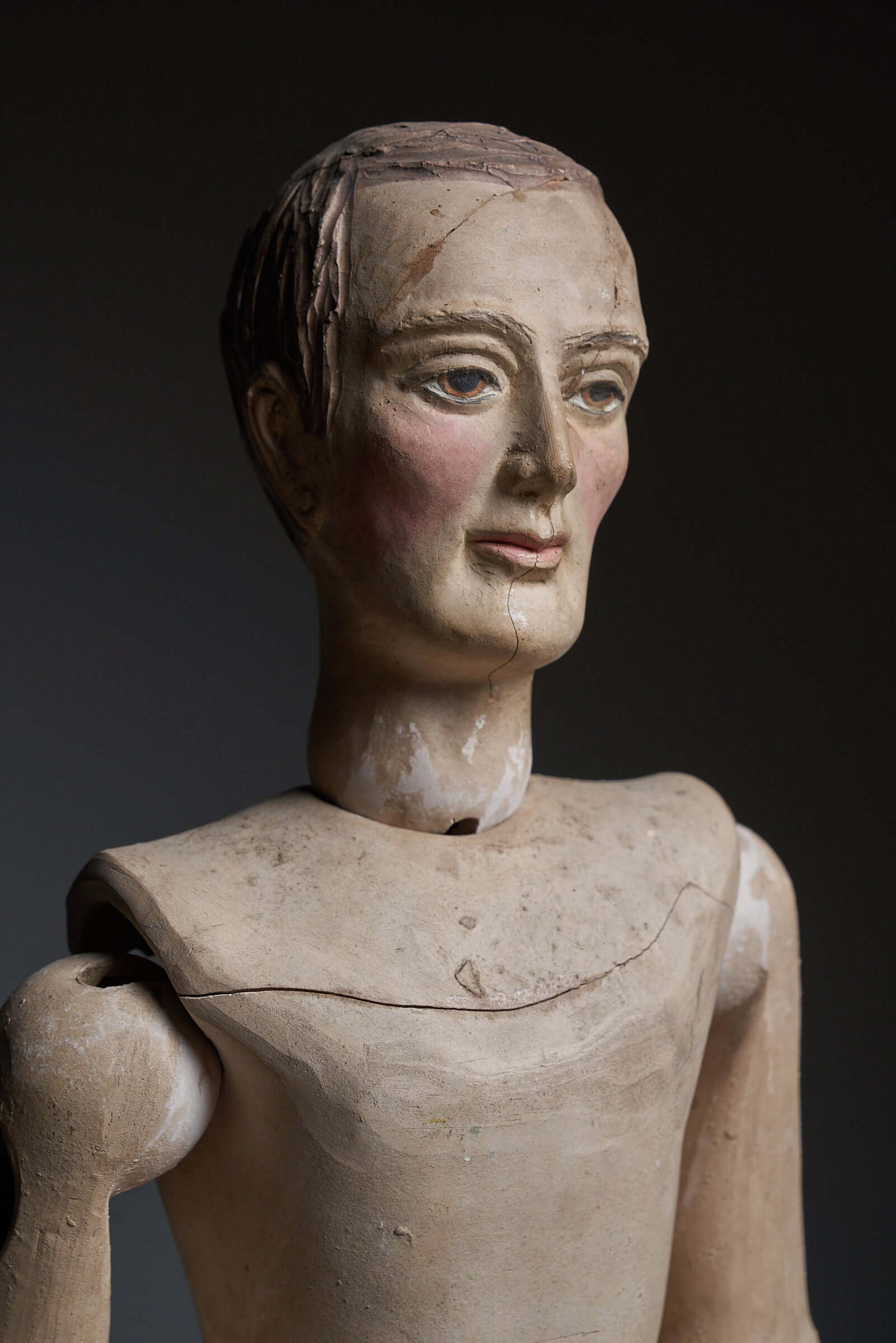 Antique terra cotta articulated mannequin with lifelike features and movable joints from the early 20th century