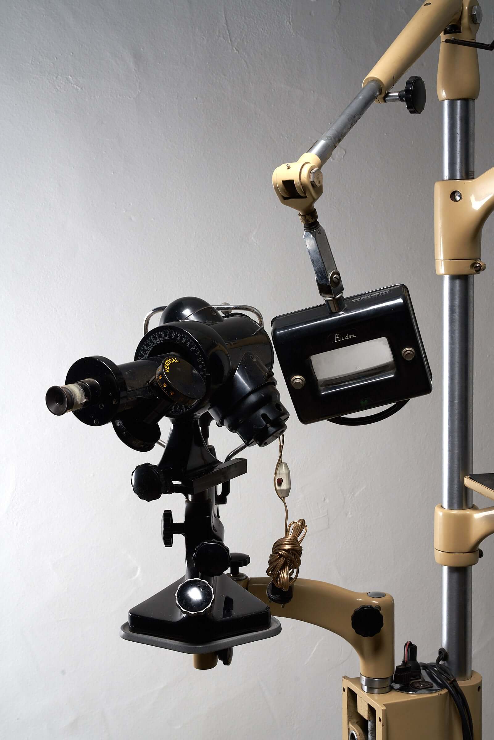 1950s vintage optometry examination equipment with adjustable arm and original optometric instruments