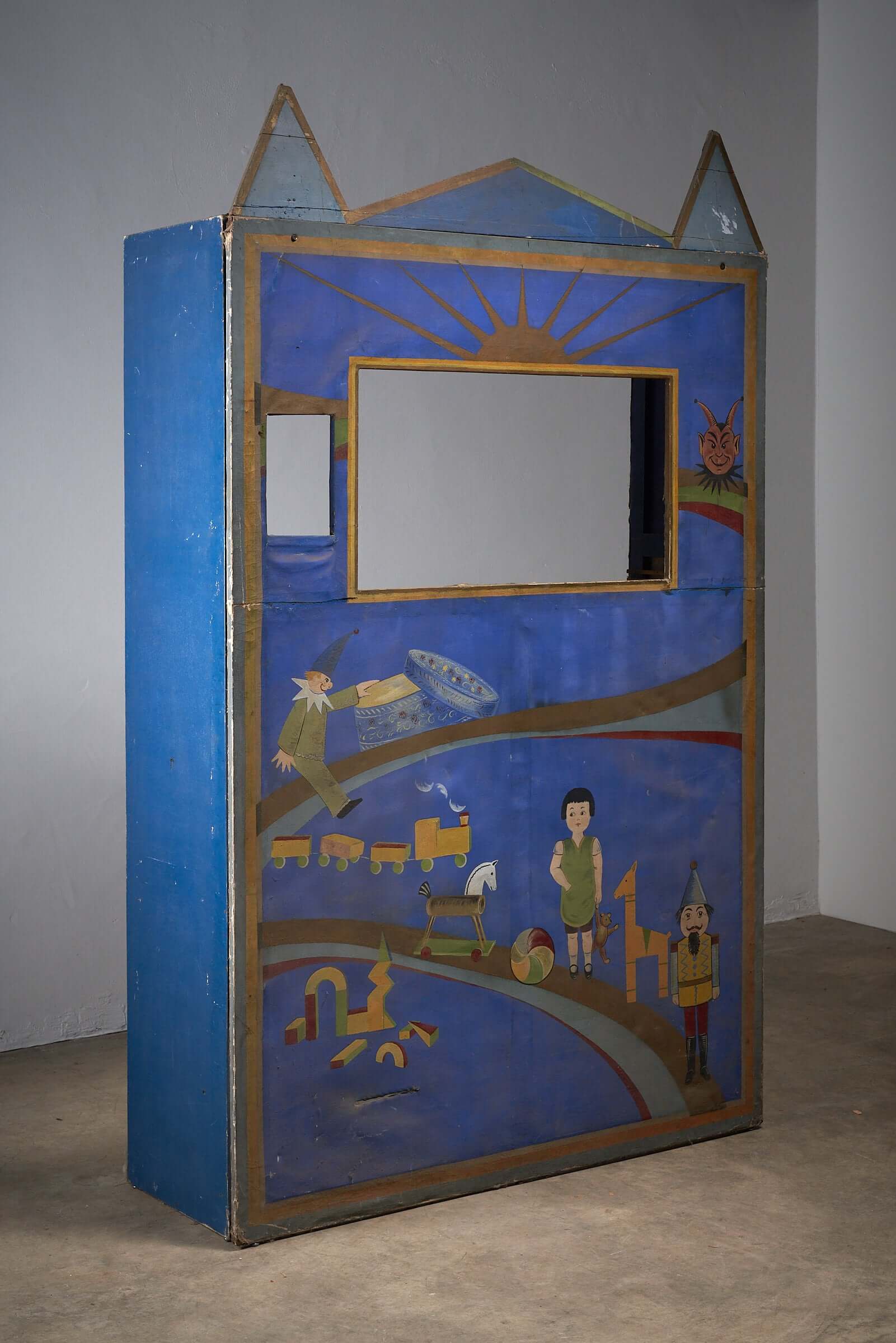 Antique hand-painted puppet theater backdrop with toys and characters, early 20th century, blue and yellow tones