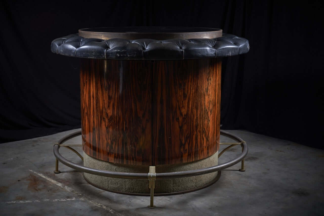 Vintage rosewood and black leather bar table with tufted edge and sturdy metal base