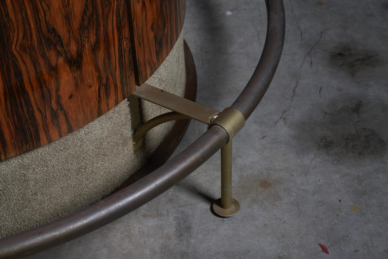 Close-up of vintage rosewood and metal base bar table showing detailed craftsmanship and elegant design