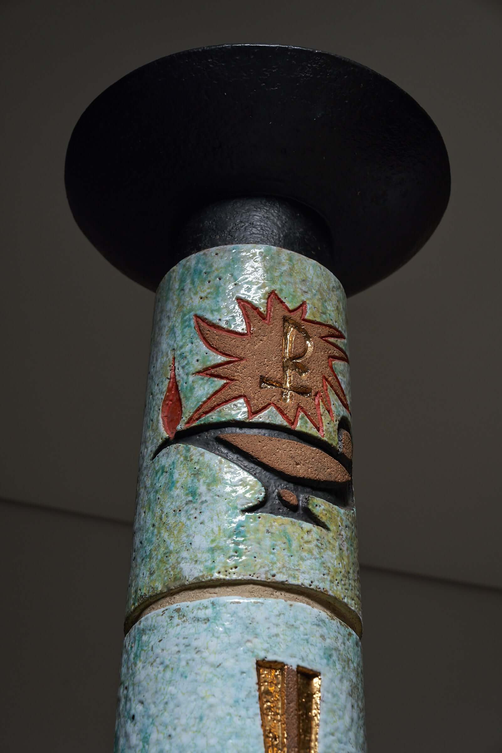 Multicolored ceramic totem with Christian symbols including the Holy Spirit depiction, crosses, and Alpha and Omega, ideal for religious decor